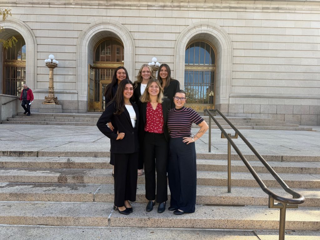 Students pose in front of the Hamilton County Courthouse