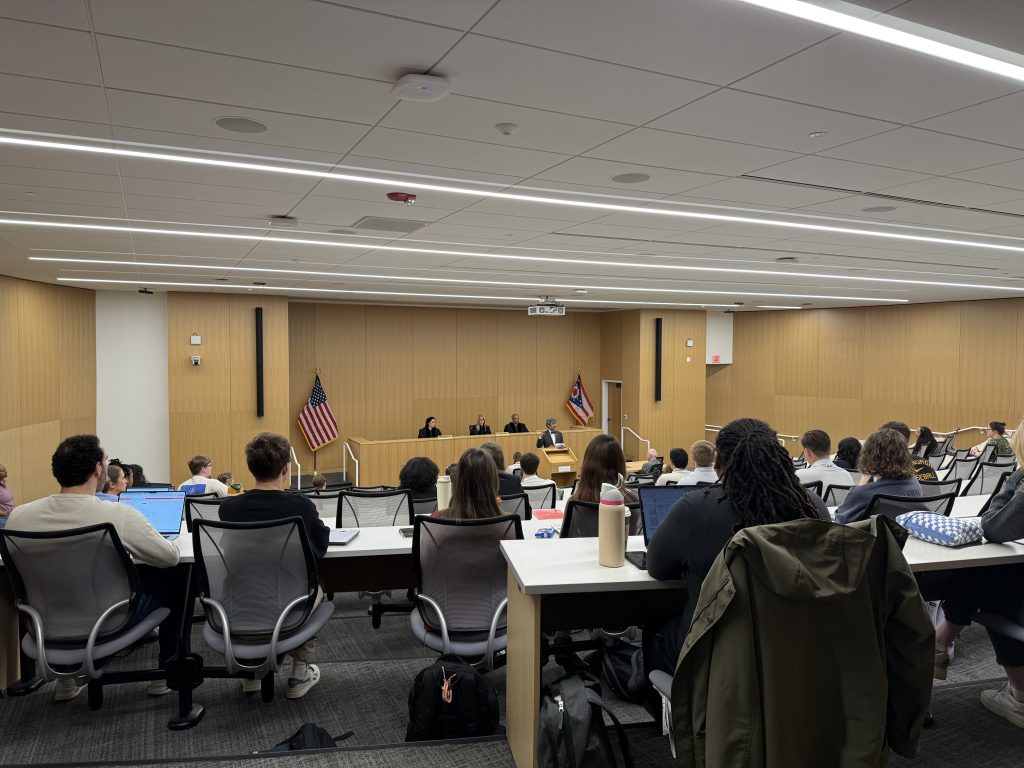 Picture from the back of the classroom shows students listening to opening remarks given by Dean Haider Ala Hamoudi