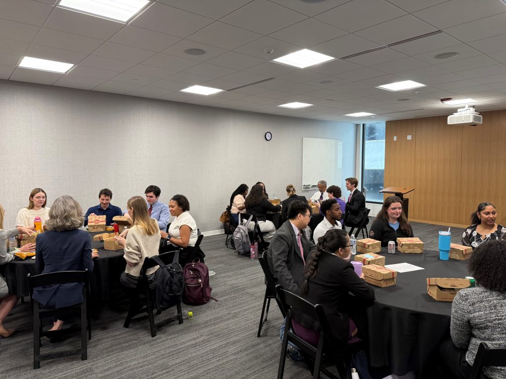 3 round tables of student eating lunch with the First District Judges and their staff attorneys