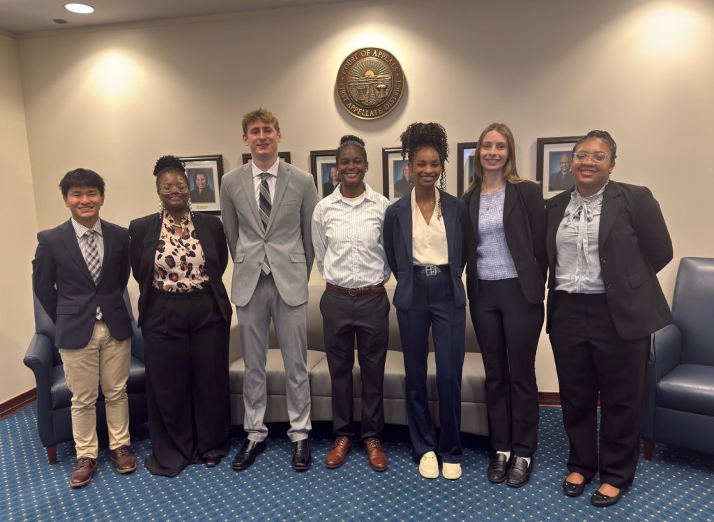 6 Summer Interns pose for a picture in the First District's lobby.